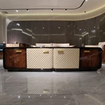 Refined TV Stand with Quilted Upholstered Panels, Natural Wood Veneer Finish and Brushed Stainless Steel Handles